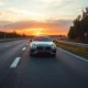 Banner image of a car on the highway representing saving on car insurance.