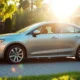 Car in suburban driveway representing affordable auto insurance premium savings.