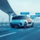 Futuristic autonomous vehicle driving on a smart highway with advanced technology systems.